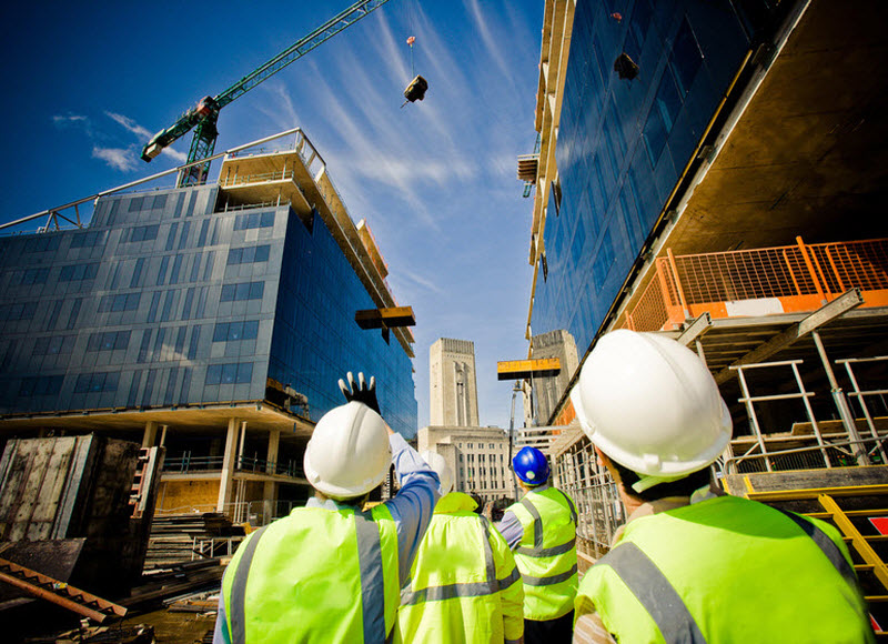 Construction workers wearing hard hats in a construction site